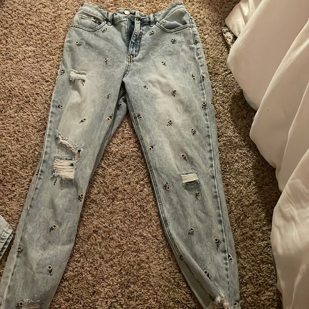 Navy blue ripped sunflower jeans